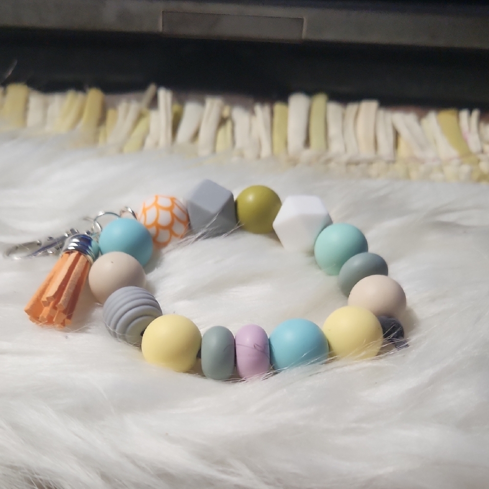 Orange and White Beaded silicone keychain bracelet Accessory with Tassel